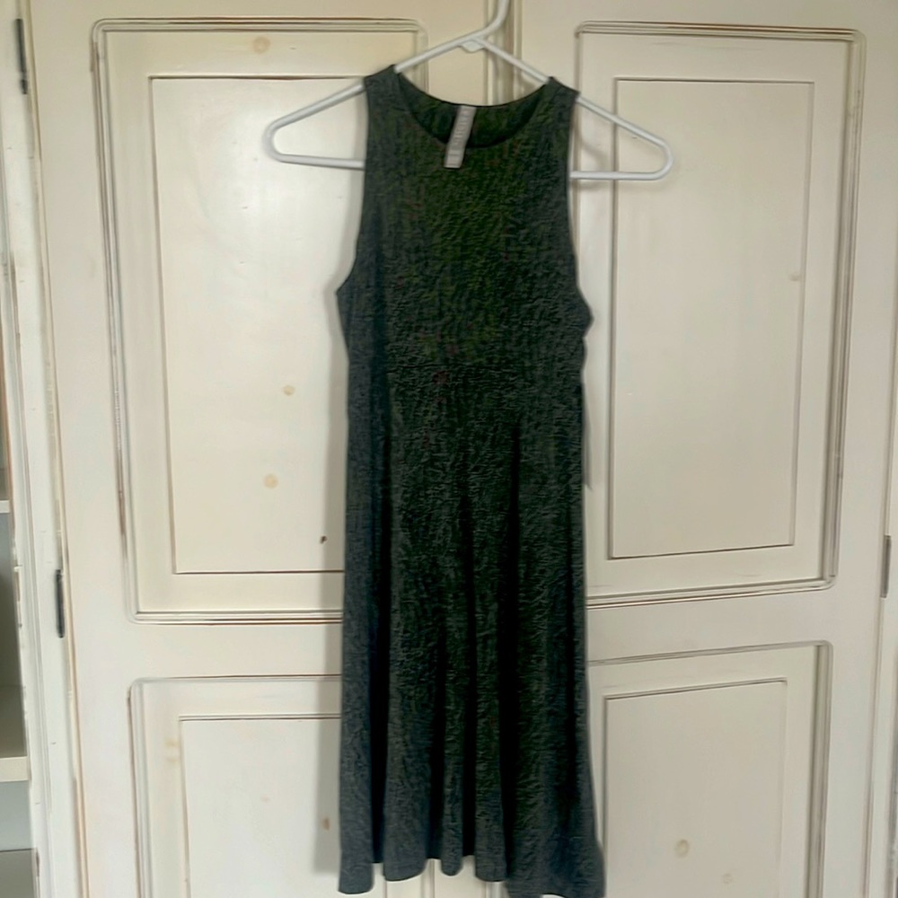 Sleeveless curved above waste flatters your form fitted flares out hits above